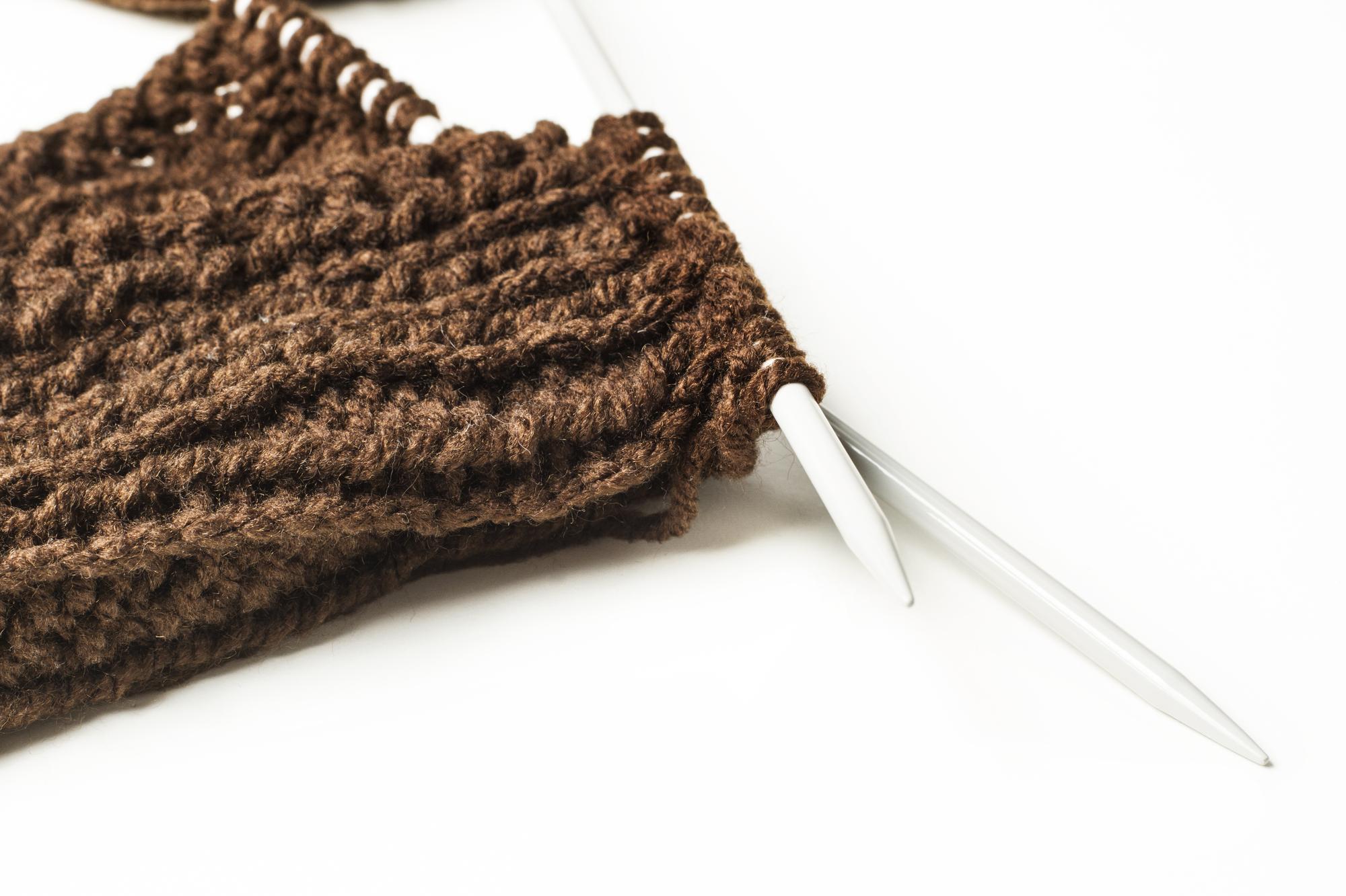 Close-up of textured threadwork in warm tones